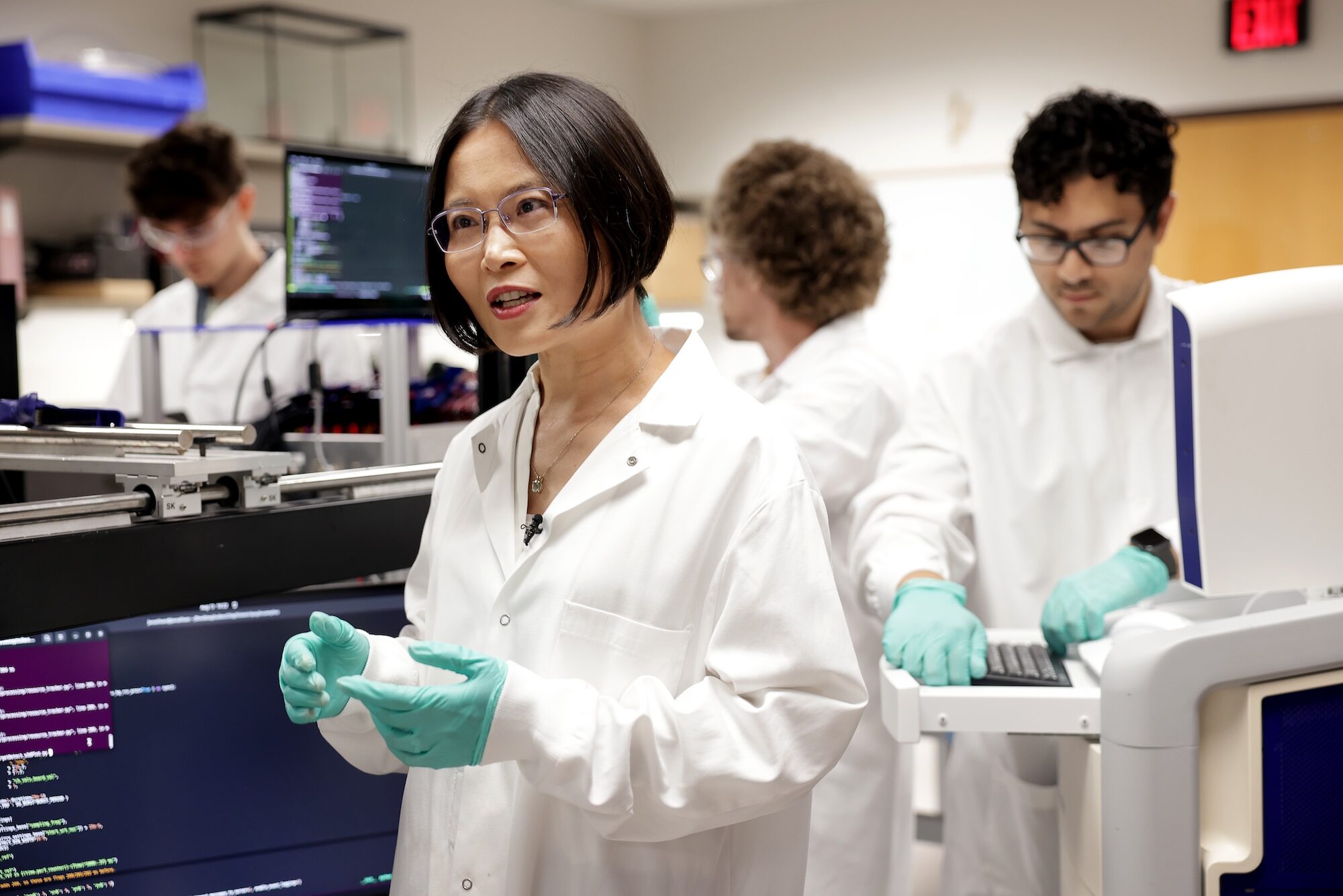 Zhen Xu, the Li Ka Shing Professor of Biomedical Engineering, works in the laboratory, fabrication and teaching space at the University of Michigan Histotripsy Center. Image credit: Brenda Ahearn, Michigan Engineering.